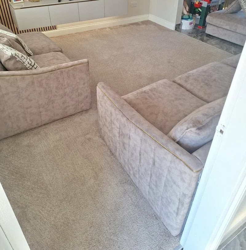 Freshly cleaned lounge carpet and grey fabric sofas after a Valiant carpet and upholstery clean