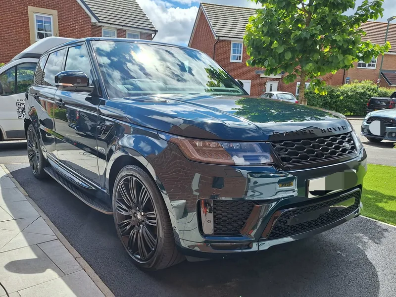 Range Rover Sport after a mobile valet with the sign-written Valiant van behind it
